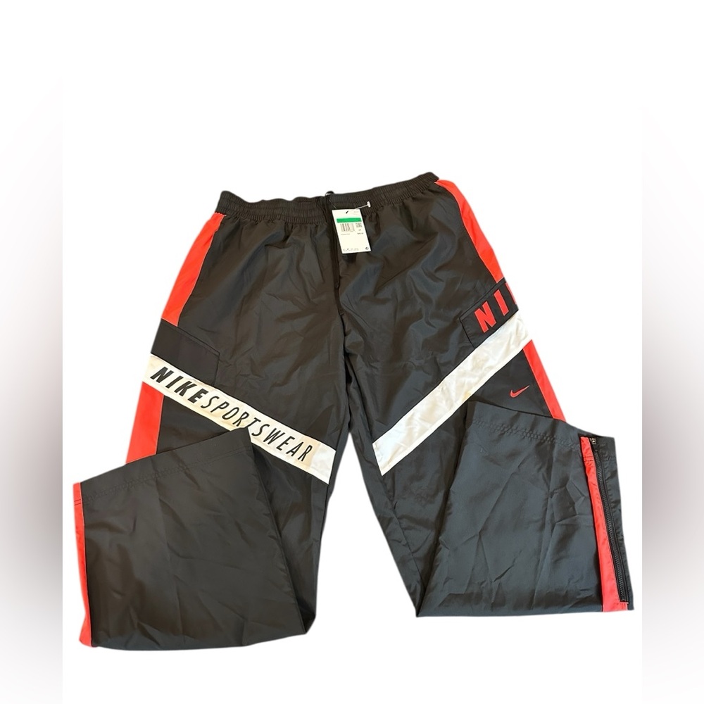 Nike Women’s Black Track Pants with Red and White Accents. Wide leg
